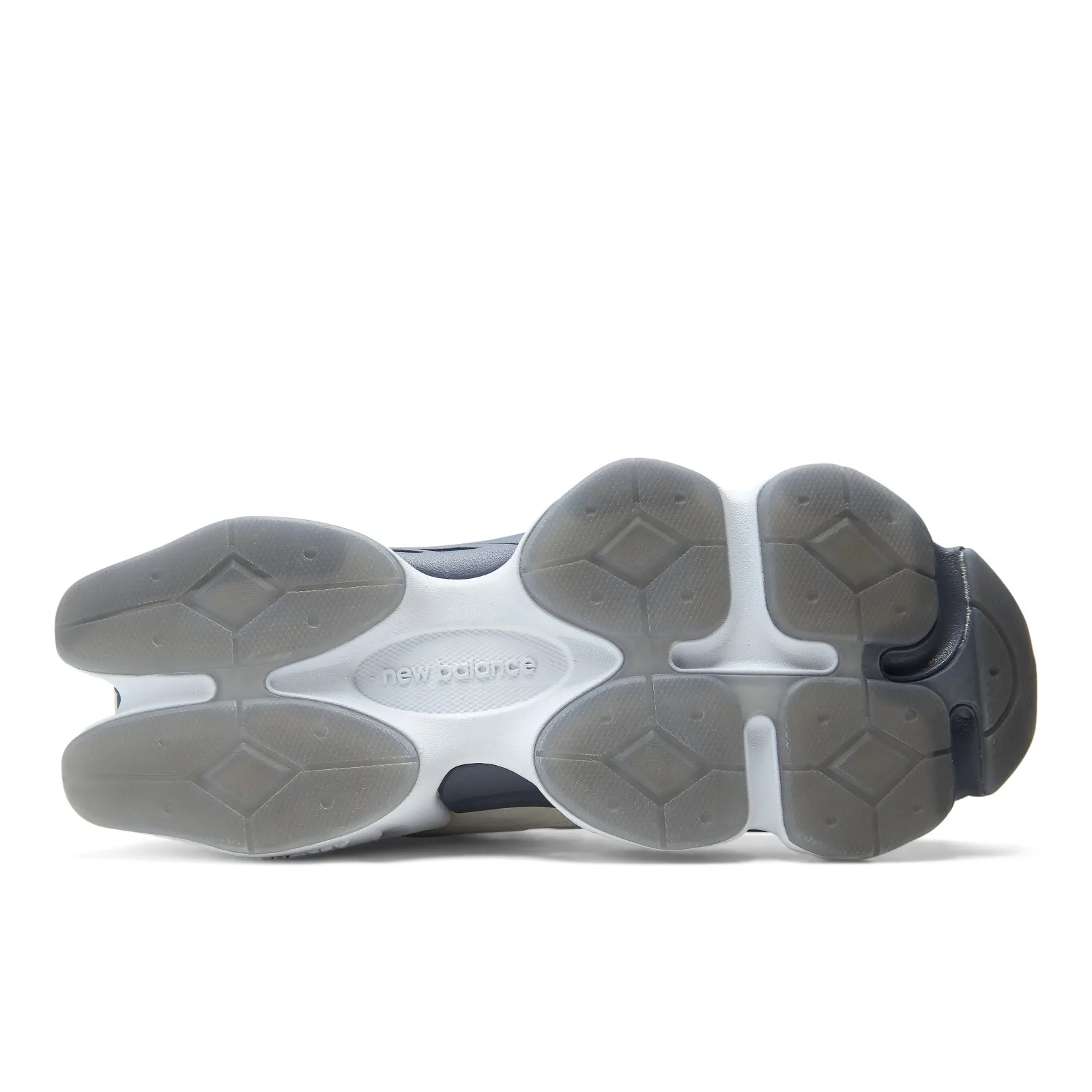 outsole detail, grey lug tread with white new balance script and navy heel plug, New Balance 9060R