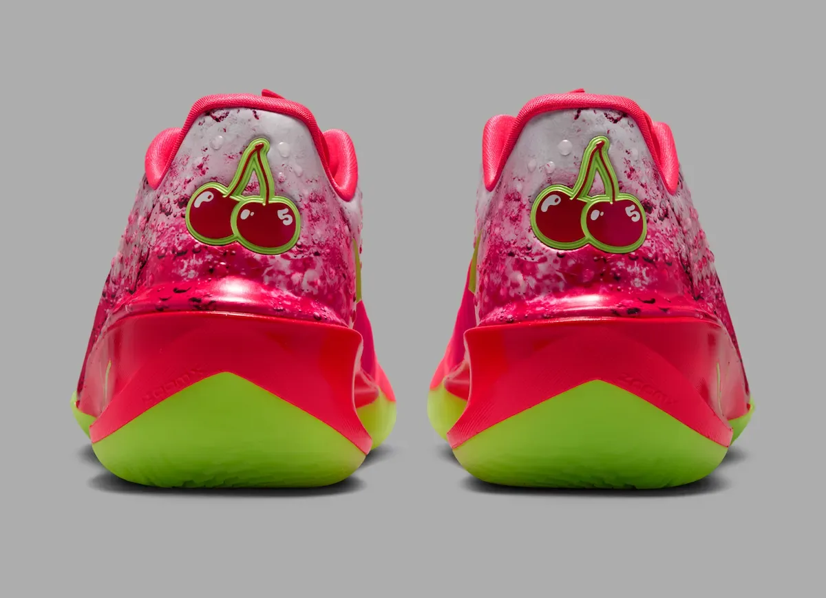Heel view showing the double-cherry logo stamped with 'PB' and '5' for Paige Bueckers over a lime ZoomX sole