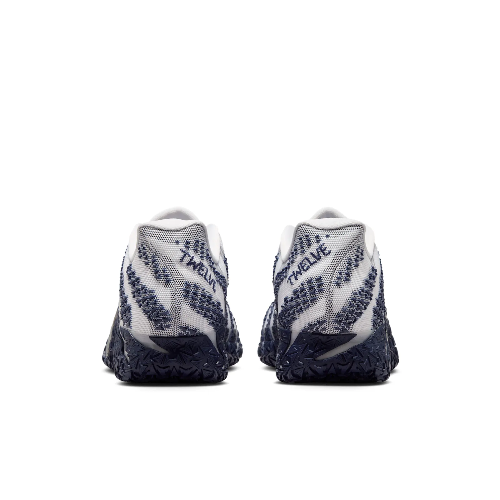 heel view of pair showing navy heel tabs with TWELVE embroidered in navy, Midnight Navy
