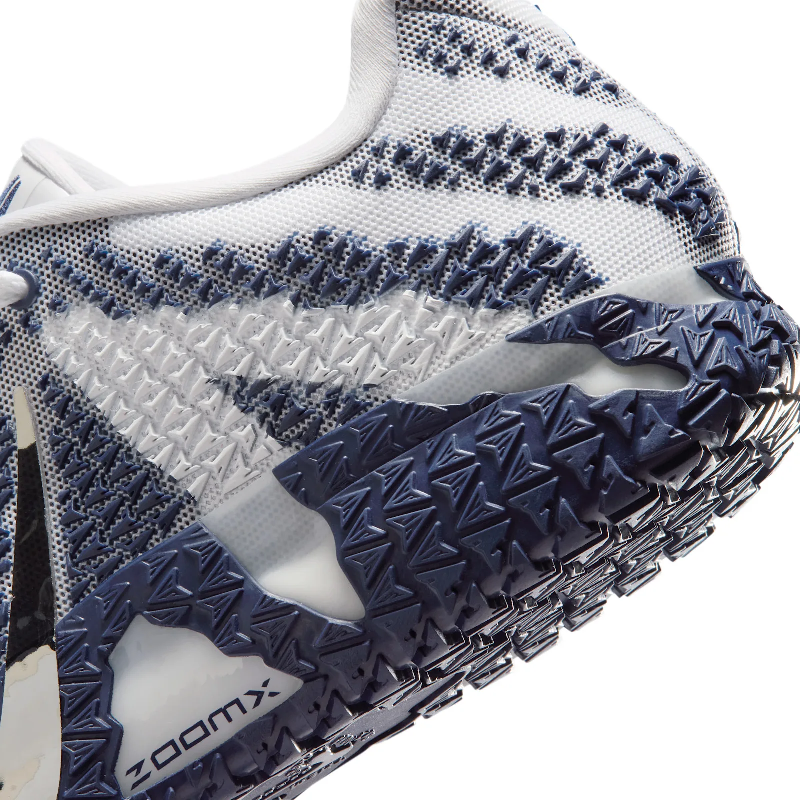 close-up of heel and midsole showing navy zigzag knit and ZOOMX branding, Midnight Navy