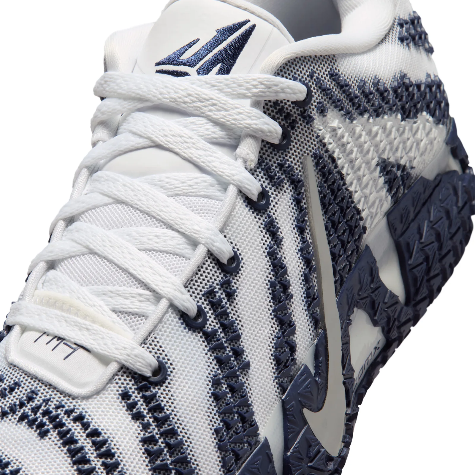 close-up of laces and toe showing white laces over navy zigzag stripes, Midnight Navy