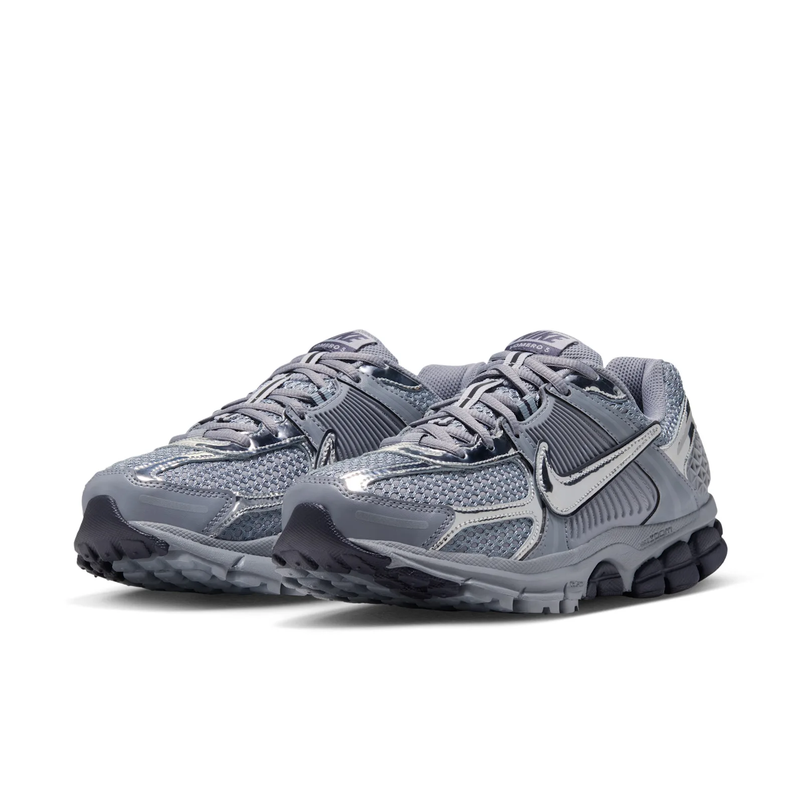 pair at angle, grey mesh uppers with silver swoosh, Vomero 5 tongue tag, Gridiron