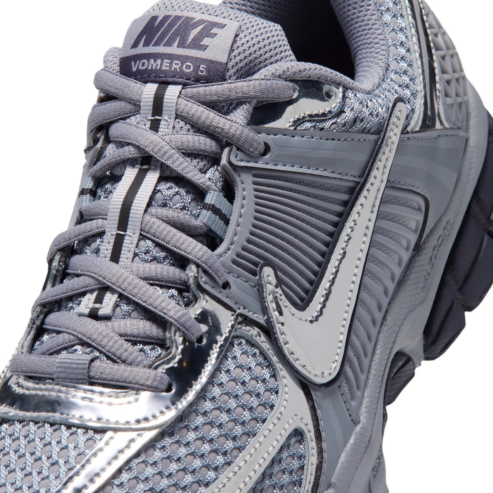 close-up toe and laces, silver swoosh over ribbed grey overlay, Gridiron