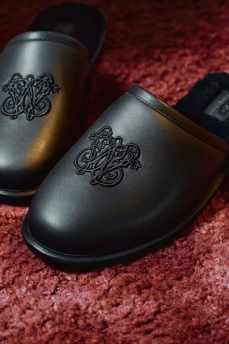 close-up embroidered emblem on the toe of a black leather mule, Willy Chavarria Collection