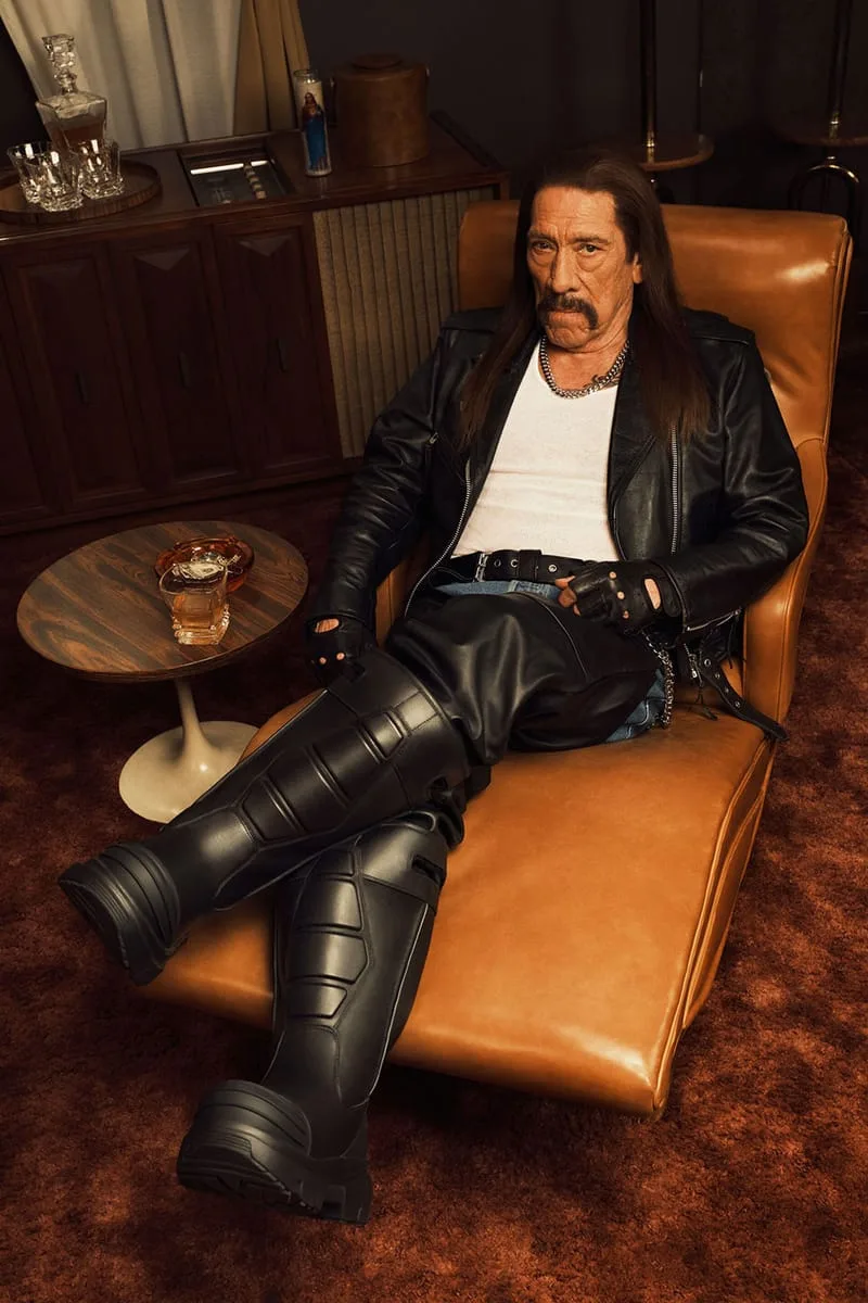on-foot, man seated in a leather jacket with tall armored-style black boots, Willy Chavarria Collection
