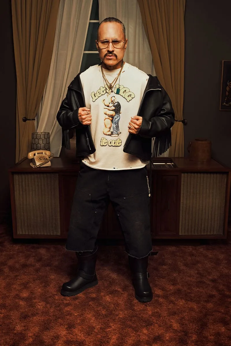 on-foot, man in a "Let UGG it out" graphic tee and leather jacket with boots, Willy Chavarria Collection