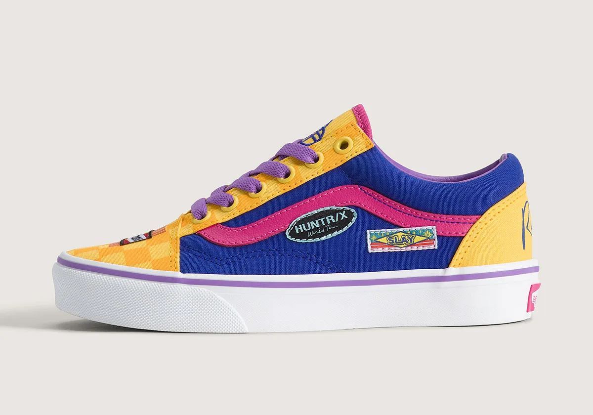 lateral view, blue/yellow old skool with pink stripe, purple laces, 'Huntr/x' patch, Demon Hunters Collection