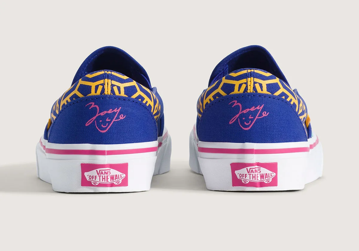 heel view, pair of blue slip-ons with yellow geometric print and pink 'Zoey' signature, Demon Hunters Collection