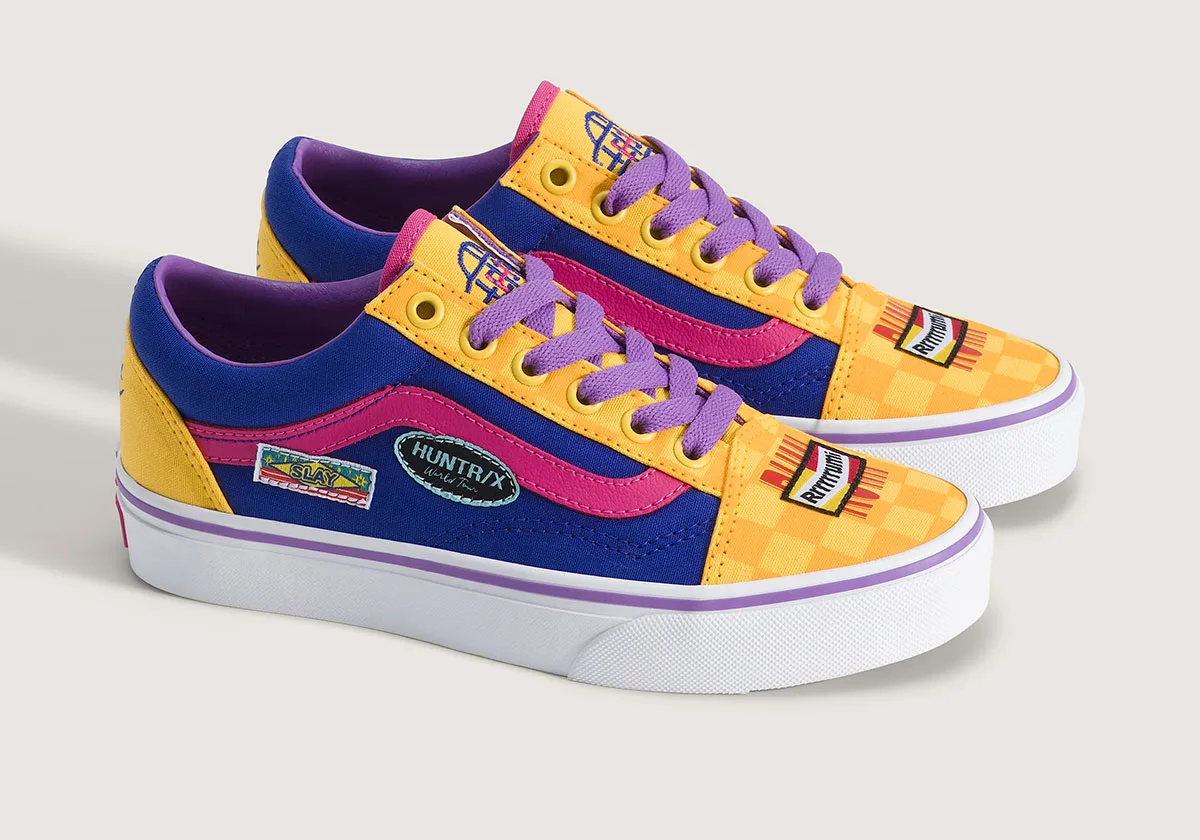 angled pair view, blue/yellow old skool sneakers with pink stripe and patches, Demon Hunters Collection