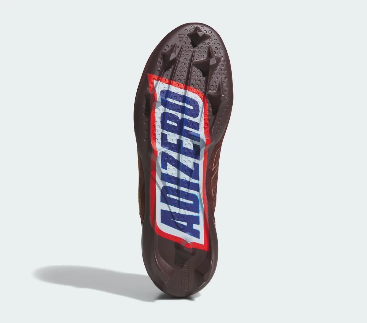outsole close-up, red white and blue 'Adizero' wordmark like a wrapper, II x Snickers