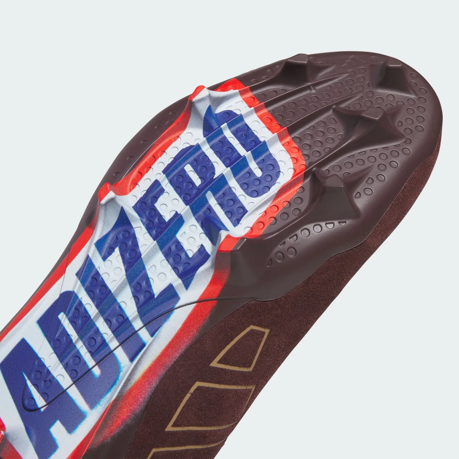 angled outsole close-up, large blue 'Adizero' lettering on white panel, II x Snickers