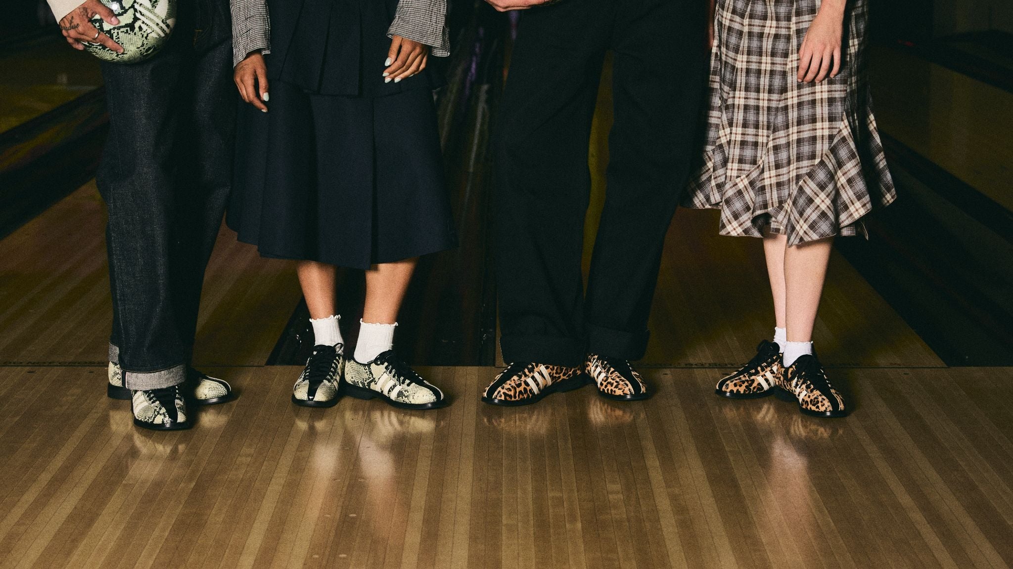 on-foot group shot showing leopard, snake and cream print pairs on bowling lane, Dead Bowling Shoe