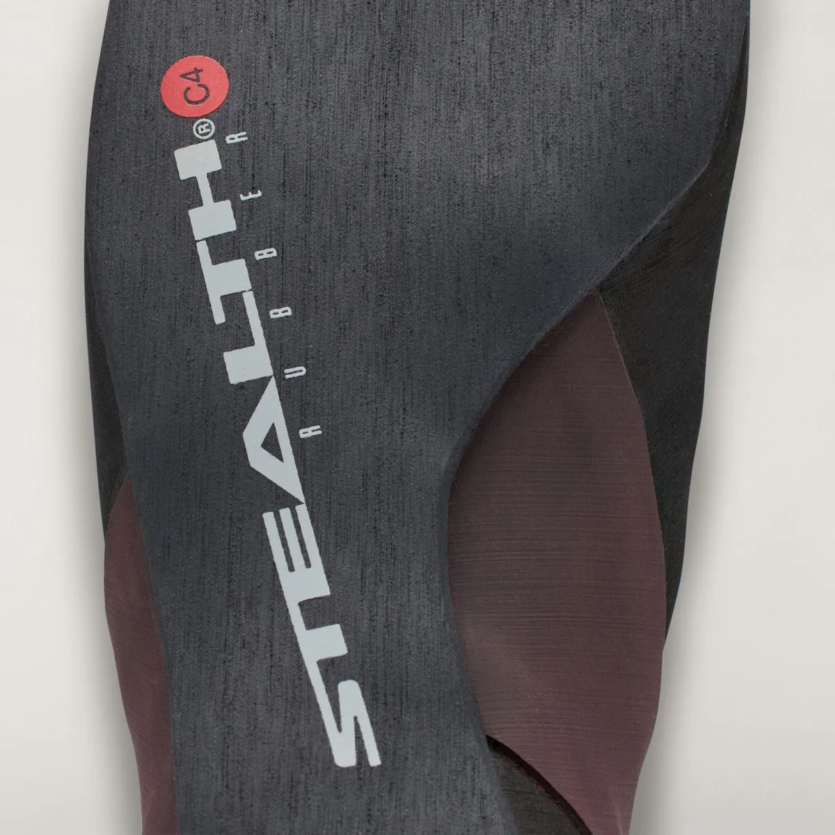 close-up of grey Stealth C4 rubber outsole texture with maroon side panel, Approach and Niad