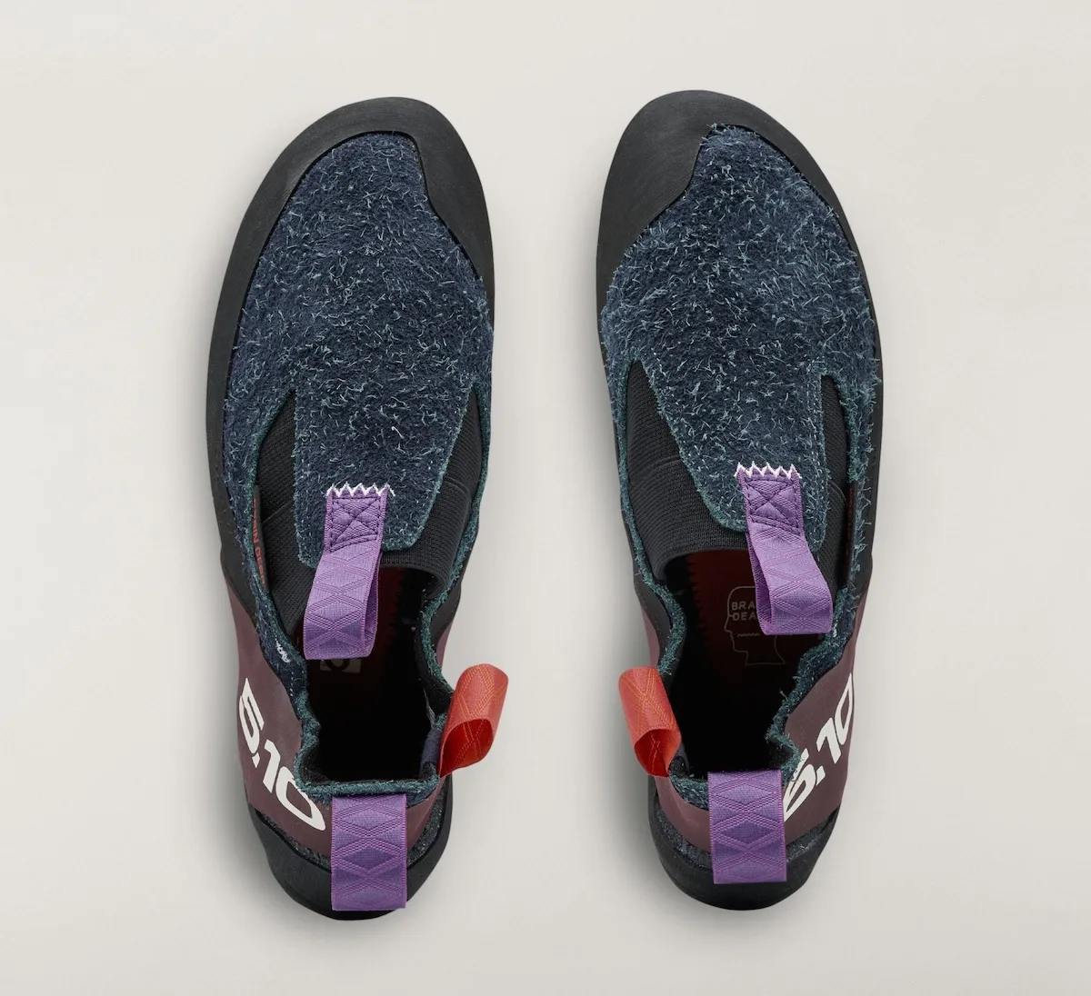 top-down view of navy slip-on pair with purple and red pull tabs, Approach and Niad