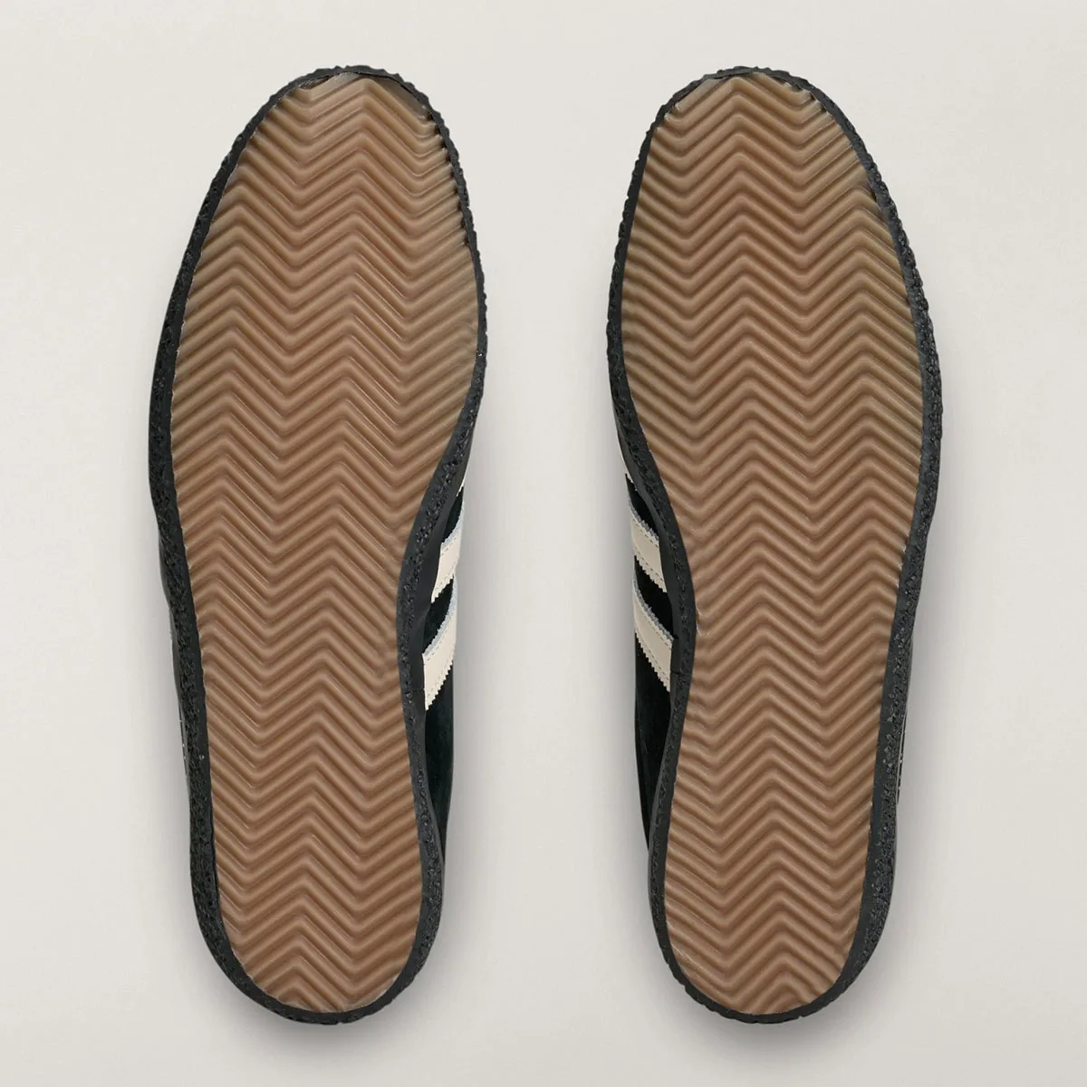 outsole view of pair, tan chevron-tread soles with black suede edging, Gazelle SPZL FC