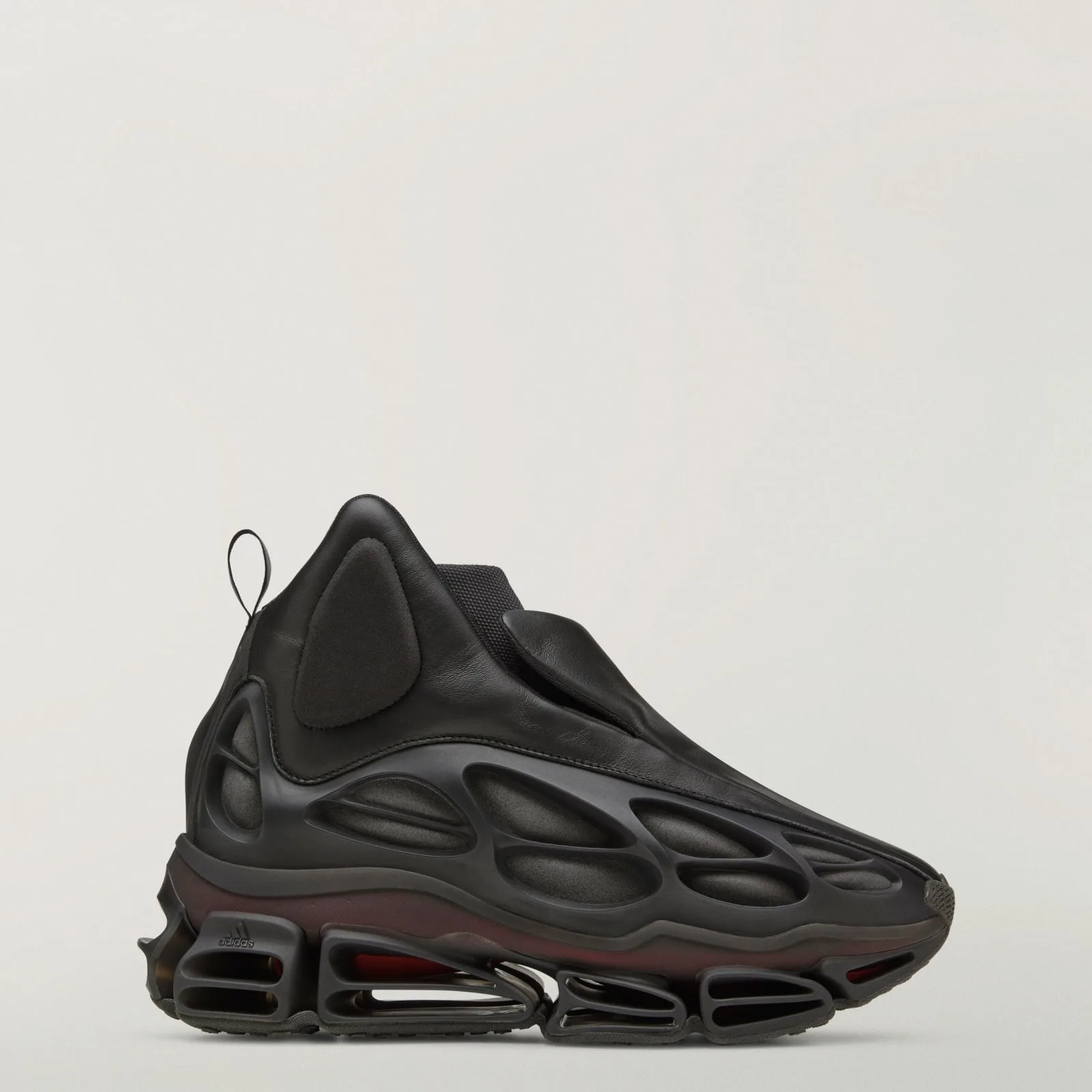 lateral view, black leather upper, sculpted vented sole, adidas logo near toe, Wolf