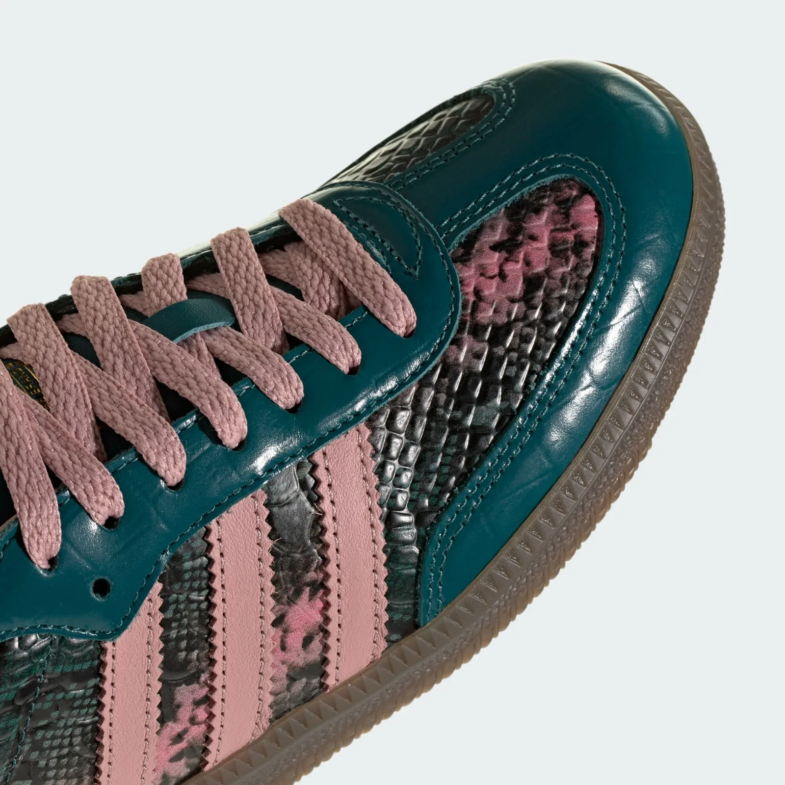 close-up of toe and laces, teal patent panel beside pink snakeskin and stripes, Teal Snakeskin