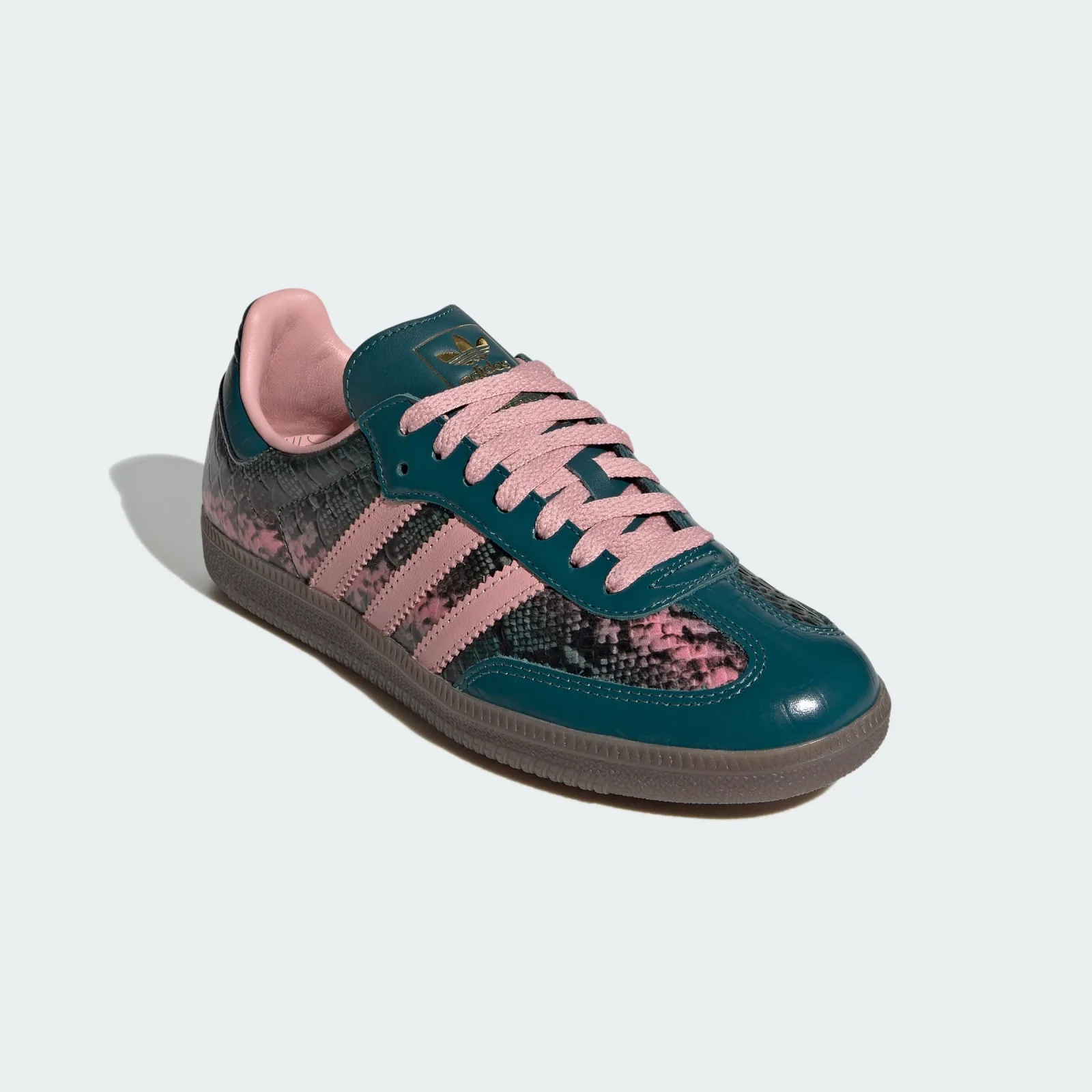 angled front view, pink lace-up detail and gold trefoil logo on tongue, Teal Snakeskin