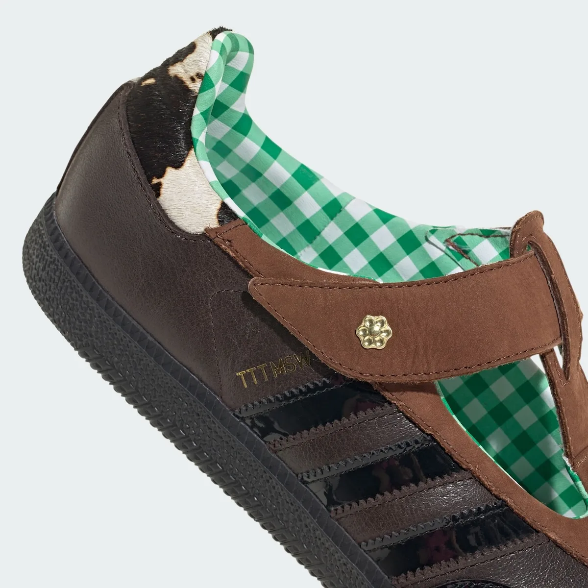 close-up of heel, cow-print panel with green gingham lining and gold stud, x TTT MSW
