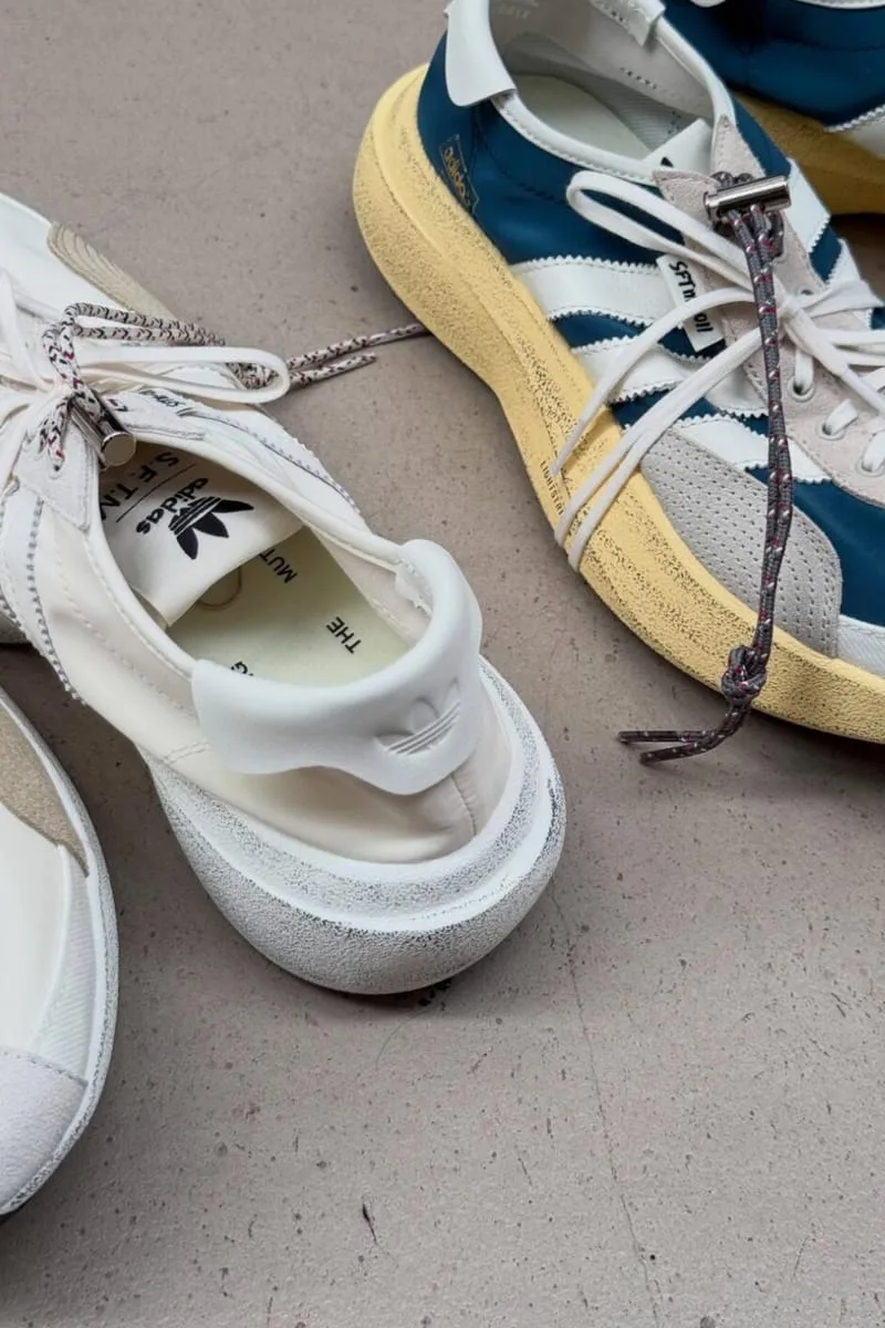 toe and lace detail, white pair beside teal and yellow pair on concrete, PRO SFTM 011)