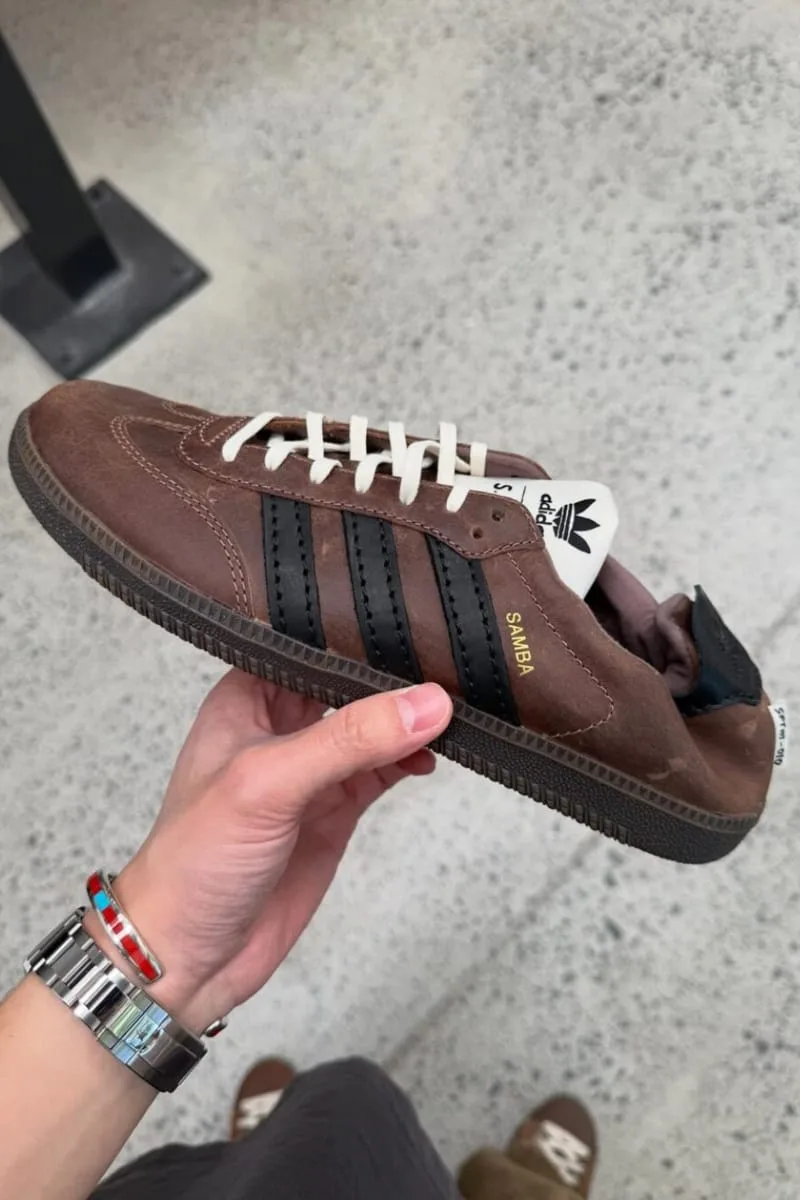 in-hand lateral view, brown leather with cream laces and white adidas tag, PRO SFTM 011)