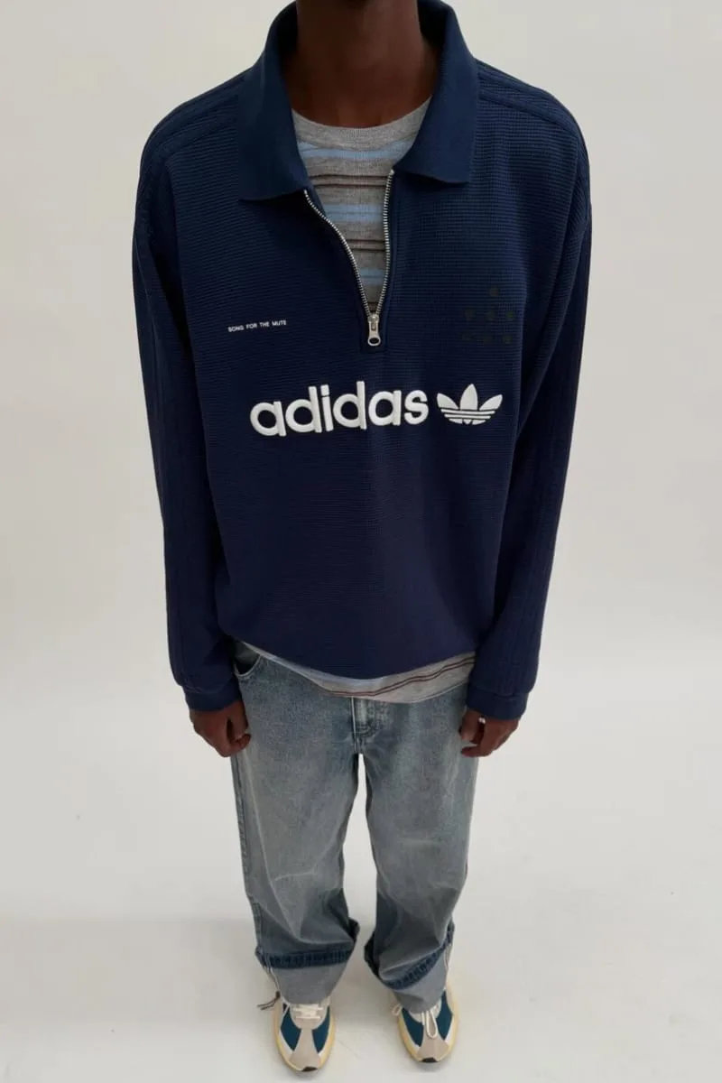 on-body navy quarter-zip pullover with white adidas trefoil logo, PRO SFTM 011)