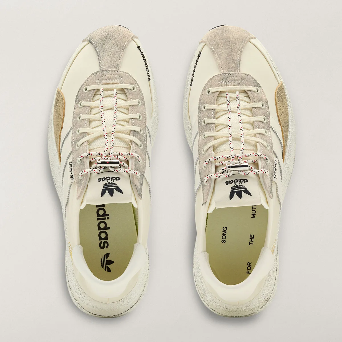 top-down view of cream SL 72 Pro pair showing adidas trefoil tongue branding, SL 72 Pro)