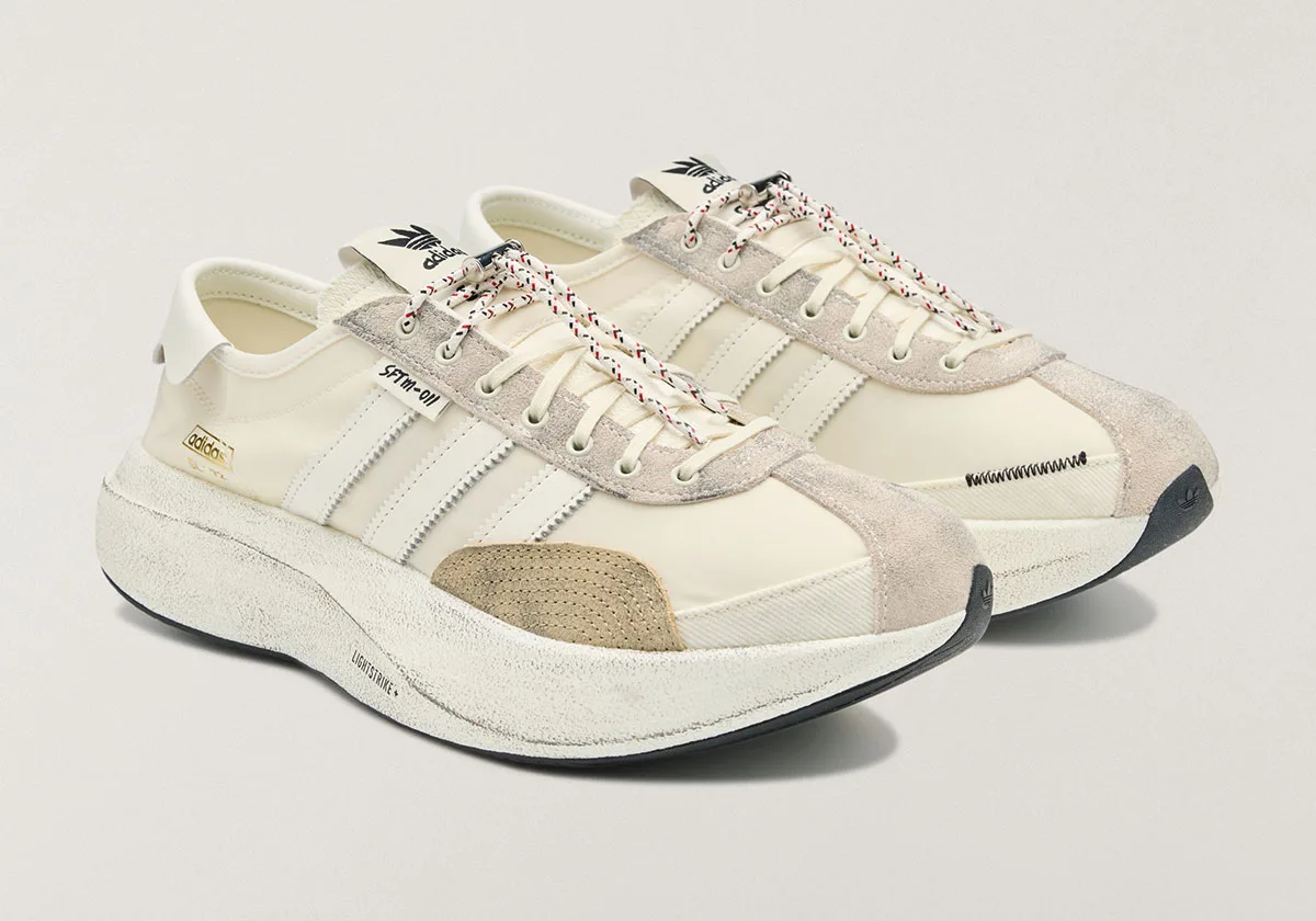 pair, three-quarter view of cream SL 72 Pro with gold adidas branding, SL 72 Pro)