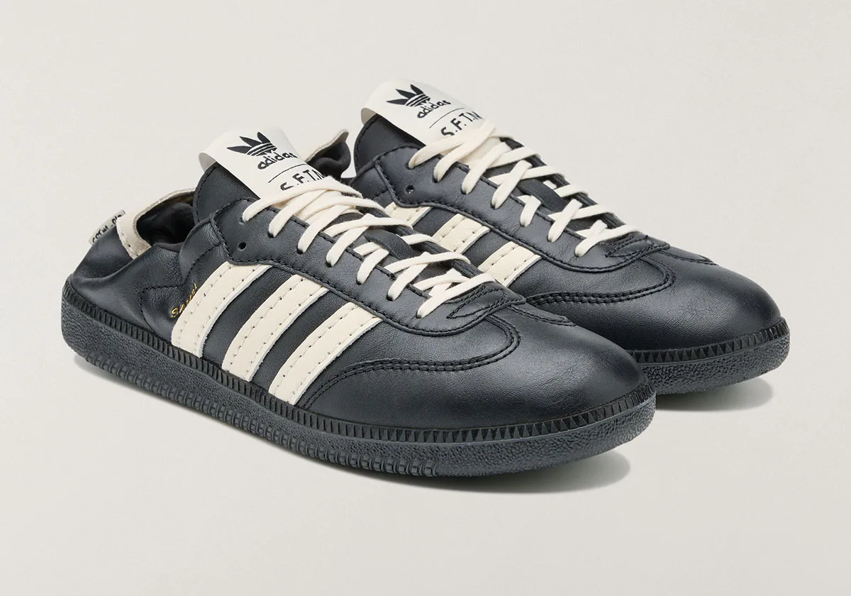 pair, three-quarter view of black leather Samba with cream trefoil tongue tag, SL 72 Pro)