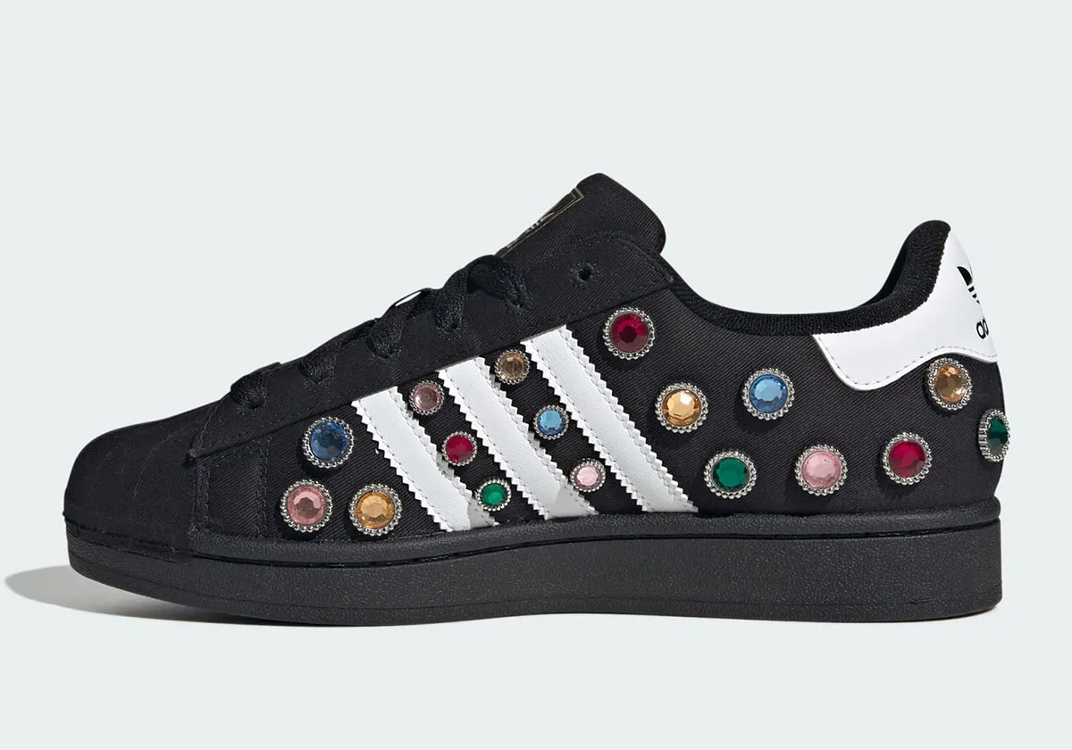 lateral view, jewel-studded black upper with white stripes and heel tab, Jewel