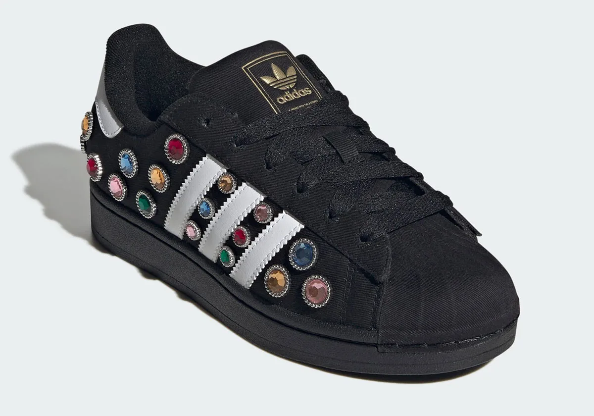 toe-angled view, black upper with multicolour jewels and gold trefoil on tongue, Jewel