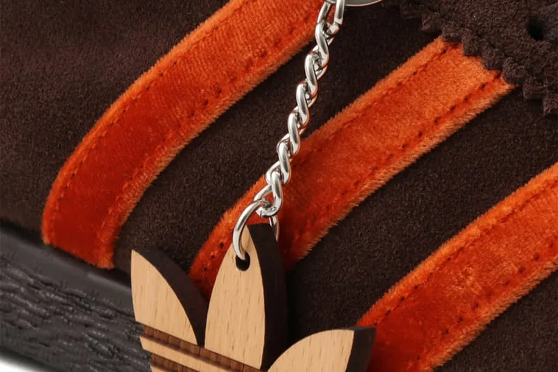 close-up detail, orange stripe stitching with wooden trefoil keychain, KOYO