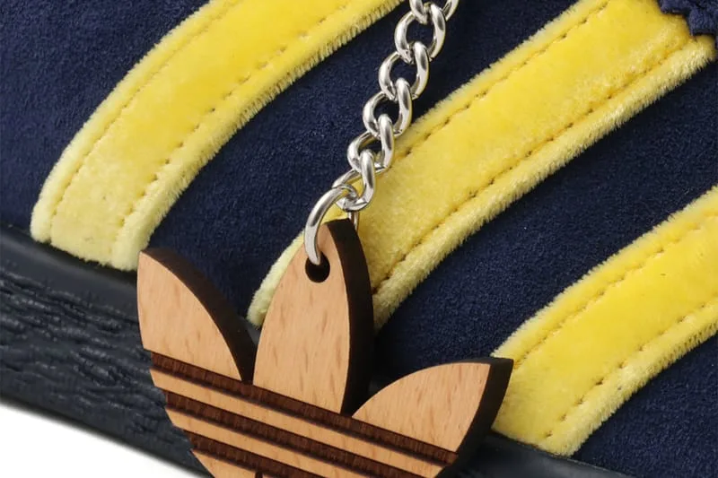 close-up detail, yellow stripe stitching with wooden trefoil keychain, KOYO