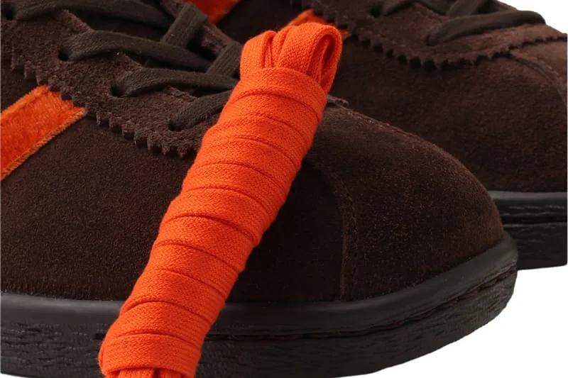 close-up detail, brown suede toe with orange wrapped laces, KOYO