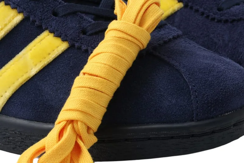 close-up detail, navy suede toe with yellow wrapped laces and stripes, KOYO