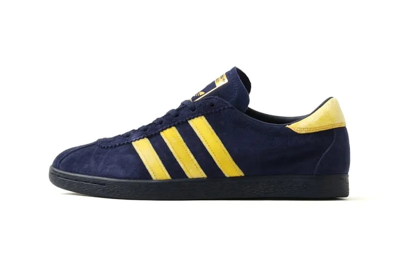 lateral view, navy suede upper with yellow stripes and gold tongue branding, KOYO