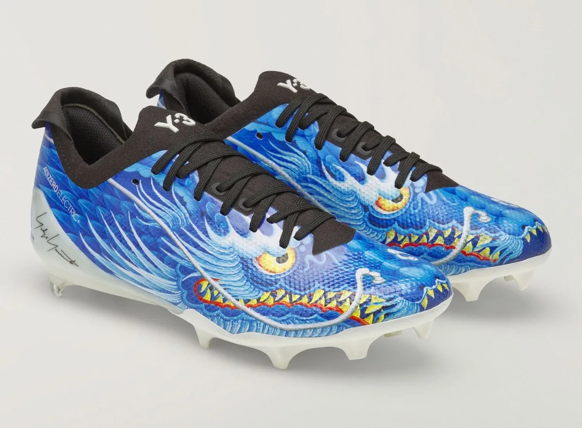Pair, blue dragon graphic cleats angled toe-forward on white background, Beast