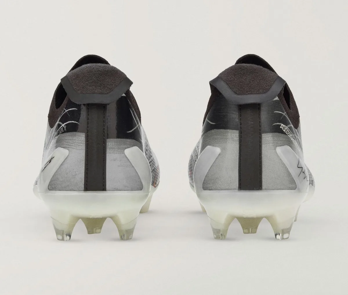 Heel view of the pair, grey pattern with black pull tab and translucent studs, Beast