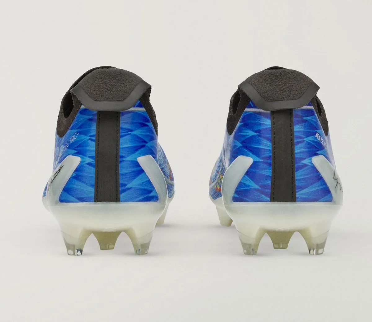 Heel view of the pair, blue feather pattern with black pull tab and white studs, Beast