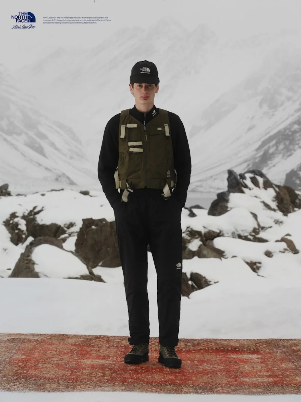 on-foot, olive utility vest with cream straps over black base layer, Fall/Winter 2026 Collection