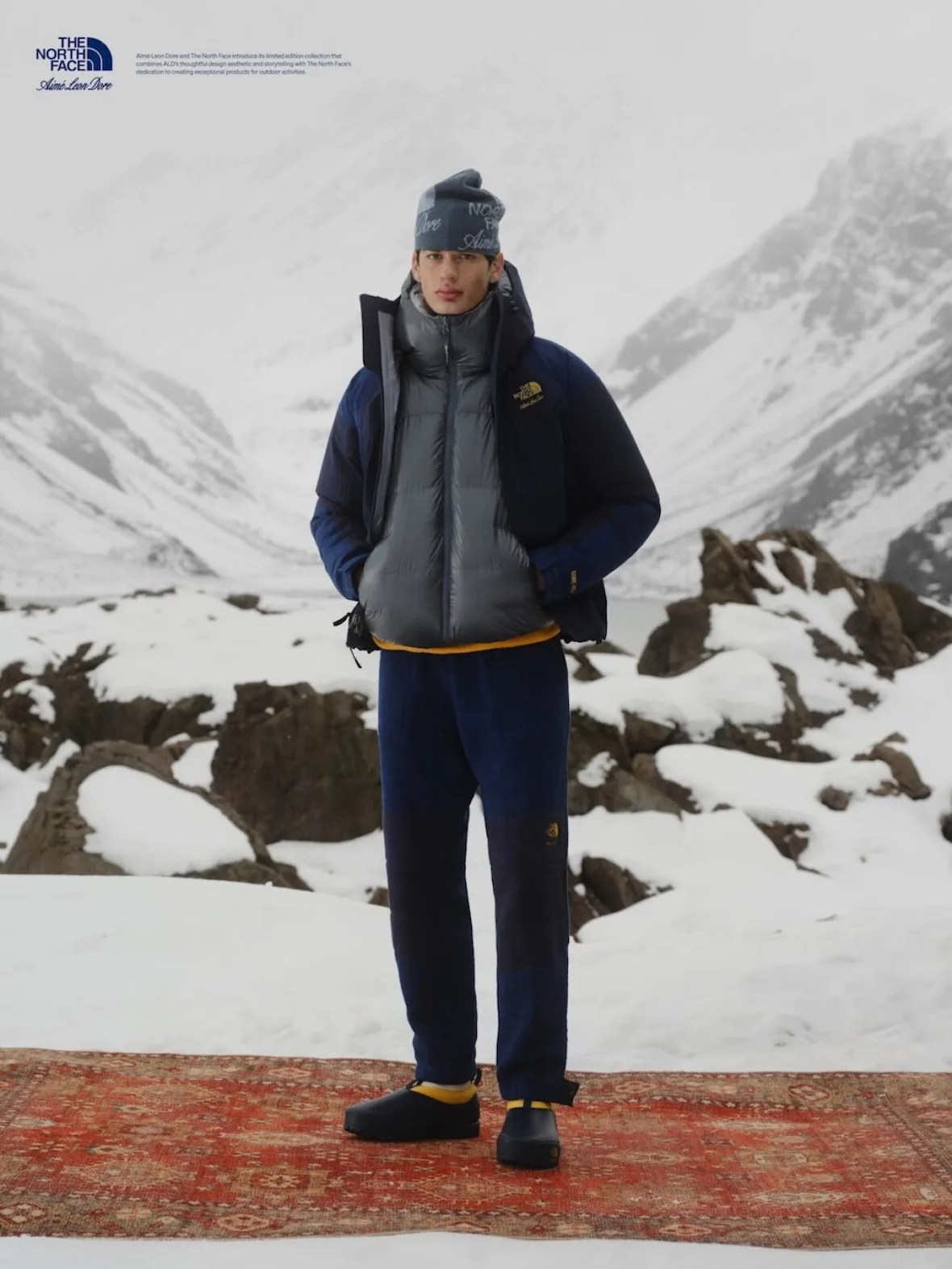 on-foot, grey puffer jacket, backpack straps, tan fleece pants, black cap, Fall/Winter 2026 Collection
