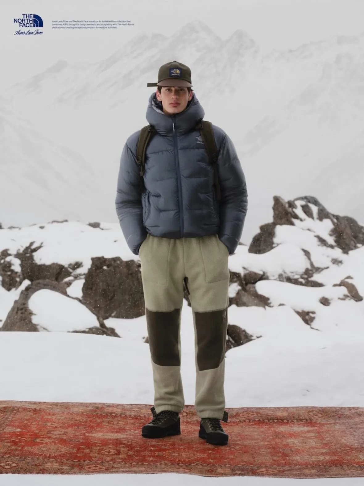 on-foot, slate grey puffer jacket over tan fleece pants, olive backpack straps, Fall/Winter 2026 Collection