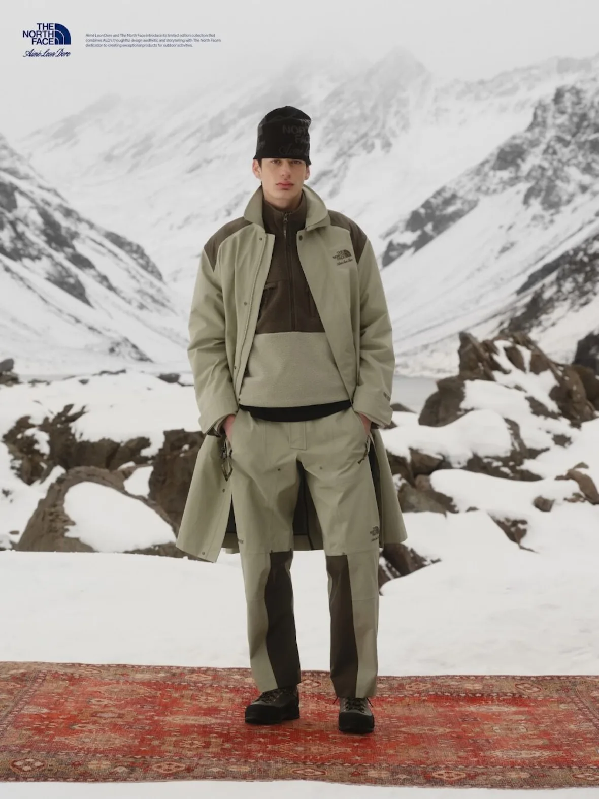 on-foot, olive and cream trench coat over layered fleece, black logo beanie, Fall/Winter 2026 Collection