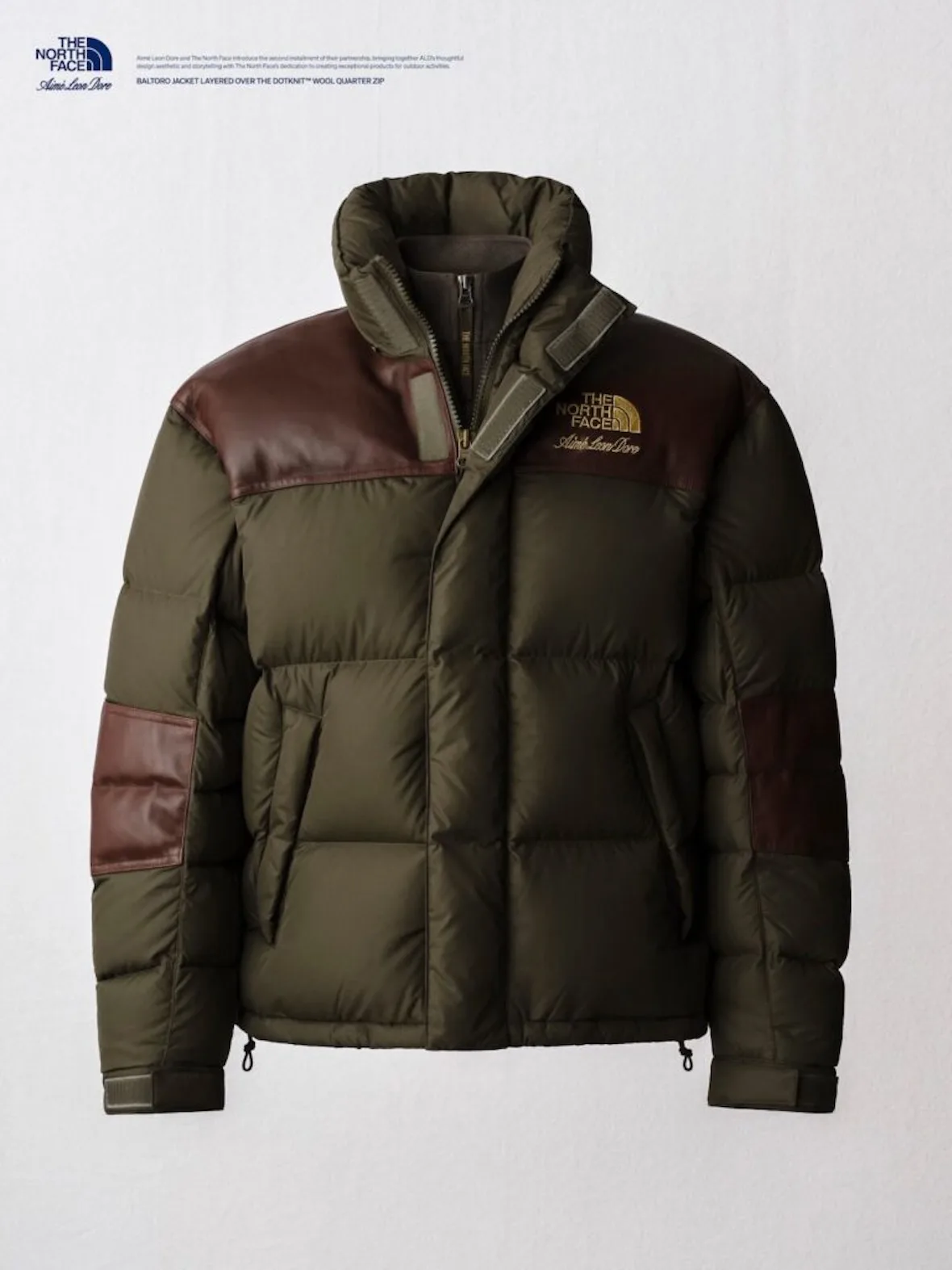 flat-lay, olive puffer jacket with burgundy yoke panels, gold logo, Fall/Winter 2026 Collection