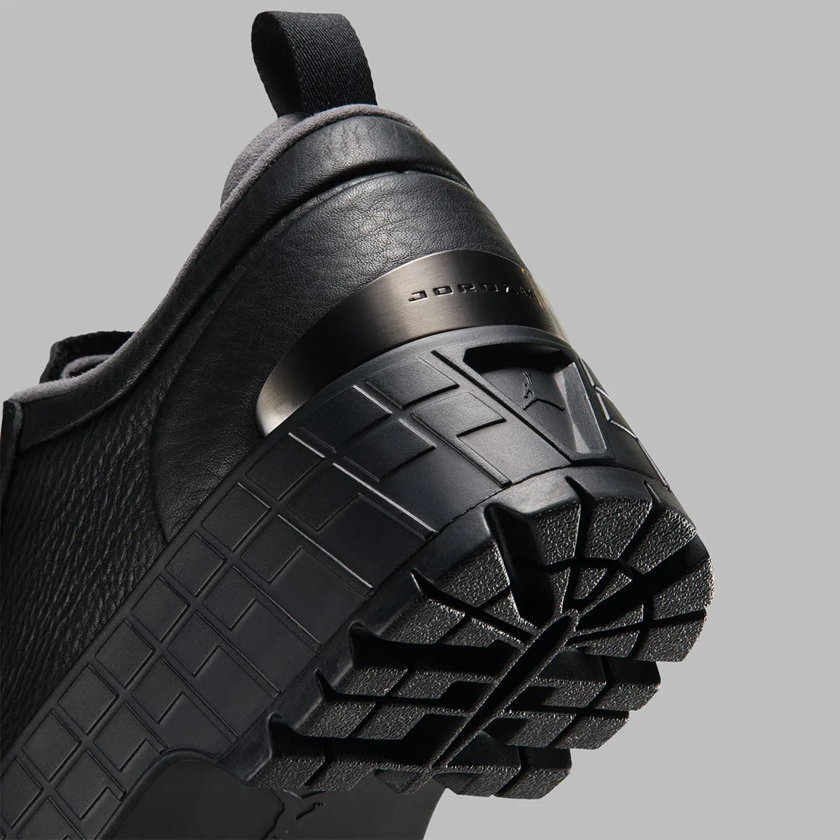 close-up heel detail, black leather with gunmetal jordan plate and lug sole, Jordan 1 Brooklyn