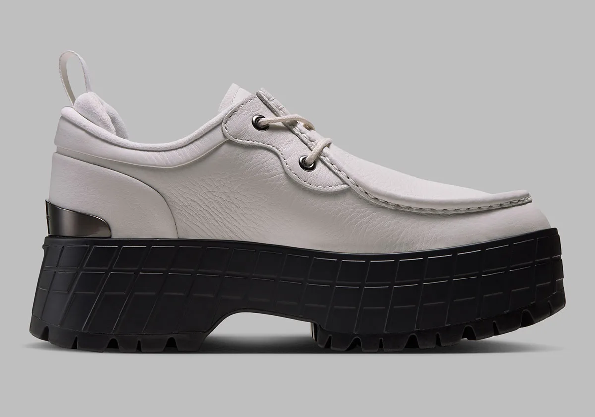 lateral view, white leather moc-toe upper with chunky black lugged platform sole, Jordan 1 Brooklyn