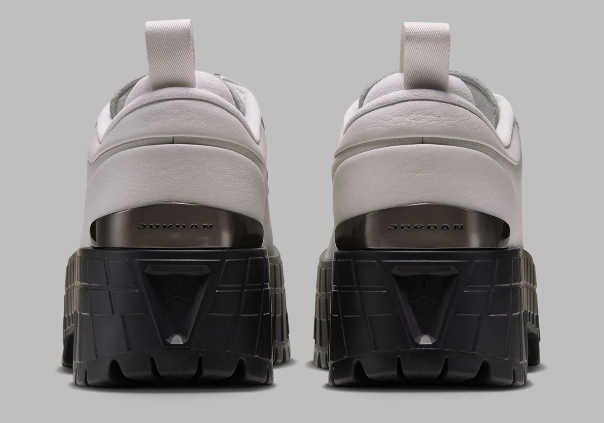 heel view, off-white leather uppers, gunmetal jordan plate on chunky black lugs, Air Jordan 1 Brooklyn in Black/White