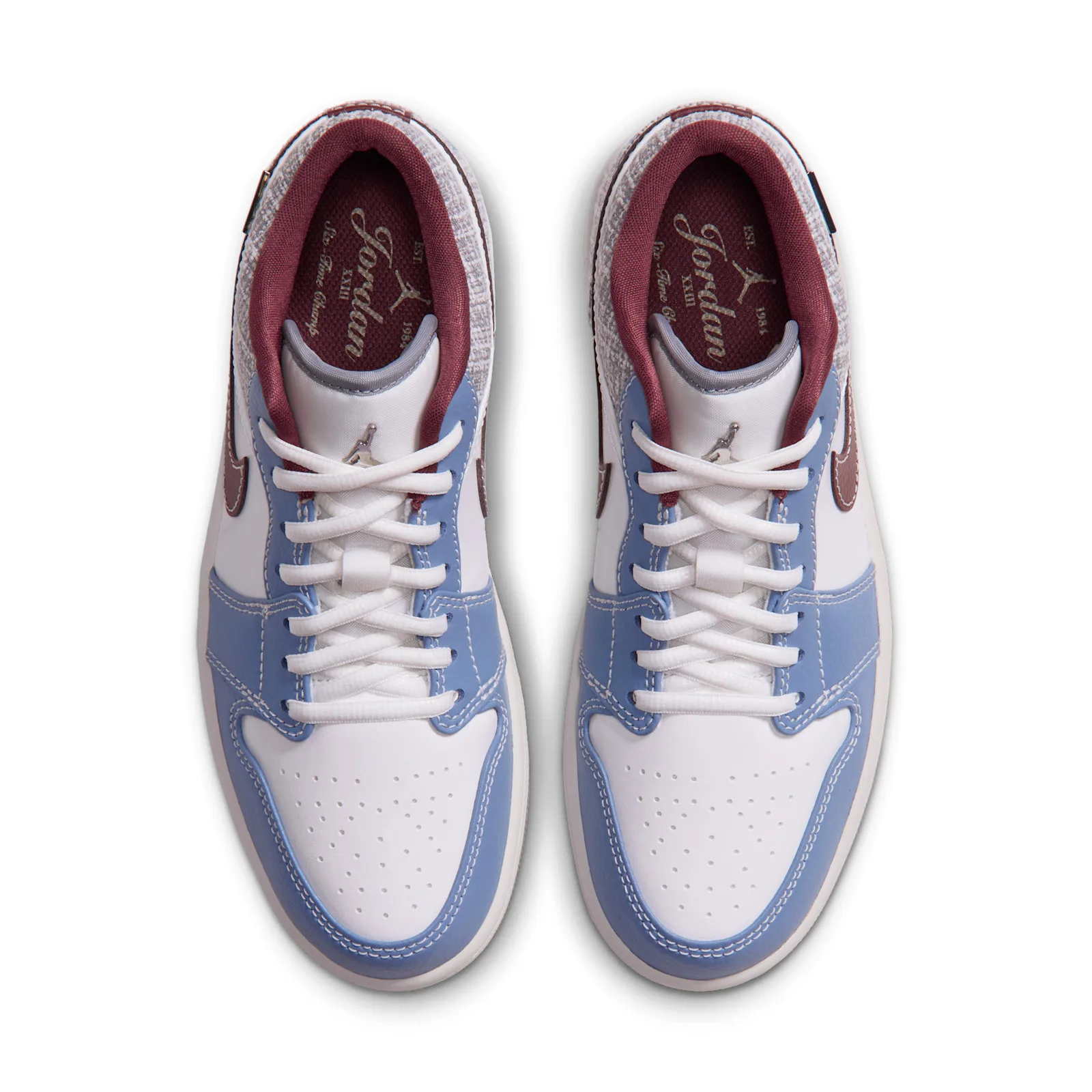 Top-down view of pair, laces tied, maroon Jordan wordmark on tongue, Bouclé