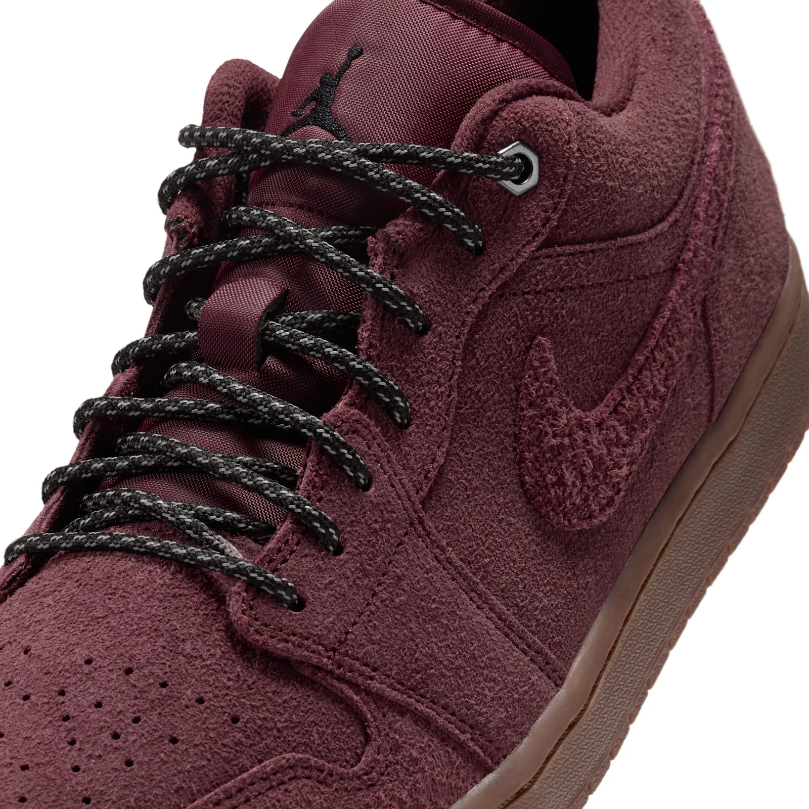 close-up of toe box and laces showing Jumpman tag and gum sole detail, Dark Team Red