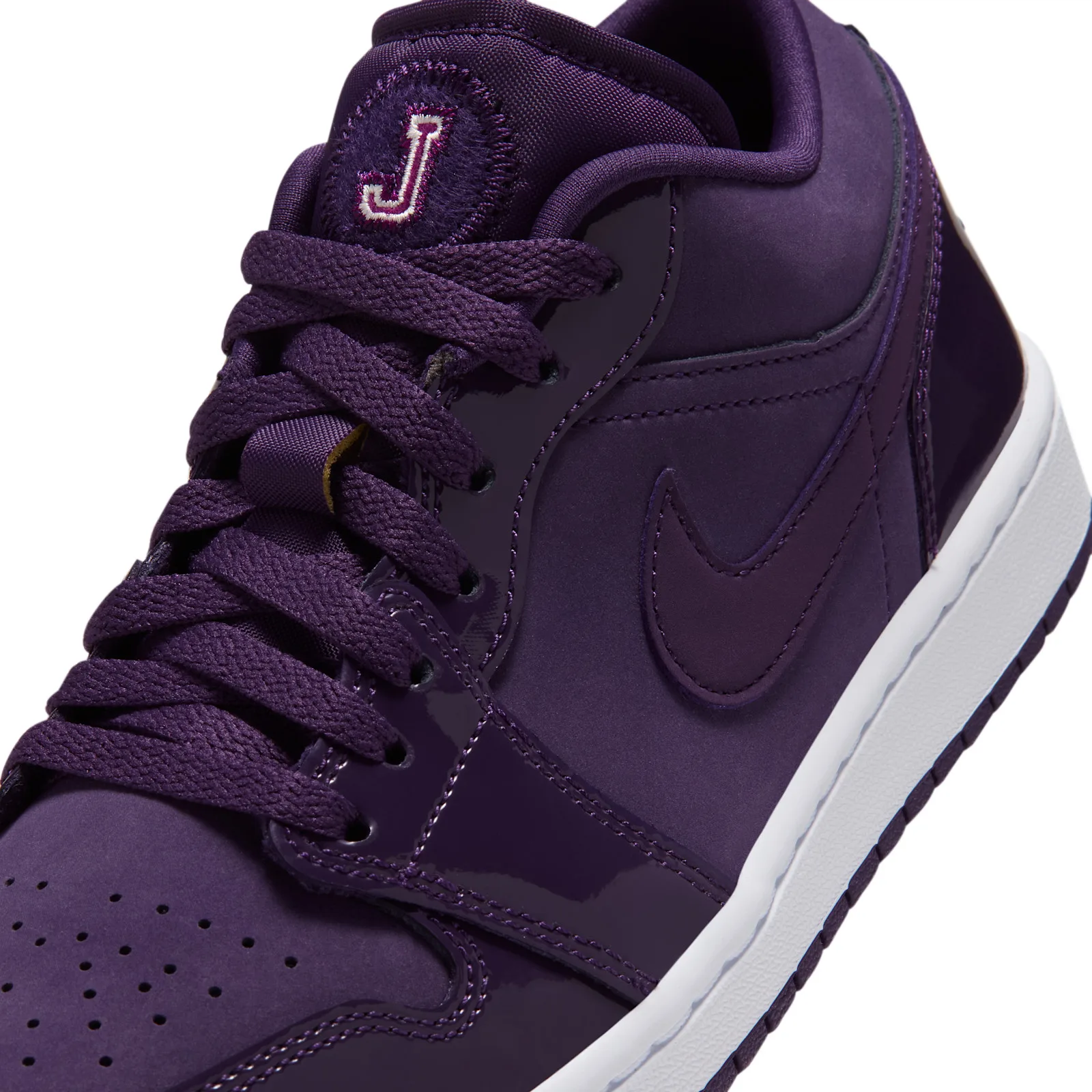 close-up toe and tongue detail, pink J patch, purple suede and patent panels, Grand Purple